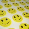 Fun bright yellow smiley face vinyl stickers on a sheet
