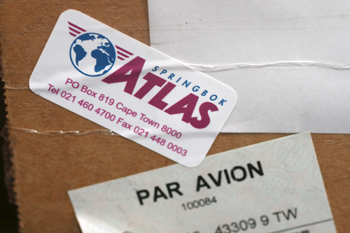 Custom vinyl logistics label applied to parcel for shipping and packaging