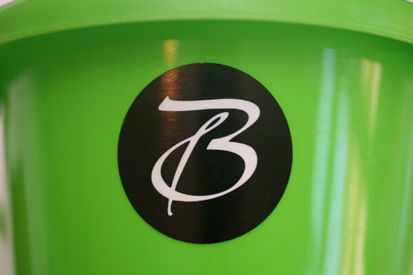 Custom vinyl sticker applied to plastic product