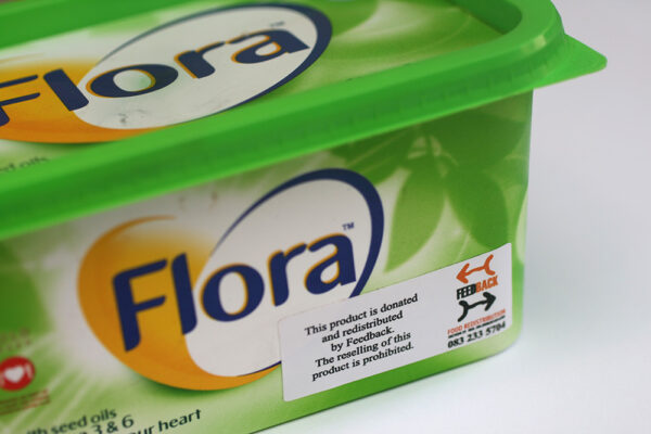 Waterproof vinyl sticker applied to refrigerated food container